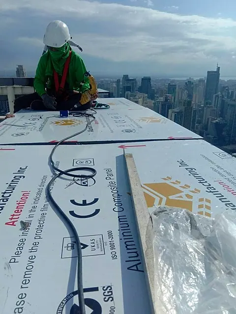 Aluminium composite panels ready for installation, high above the city